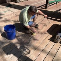 Tyler sanding the deck